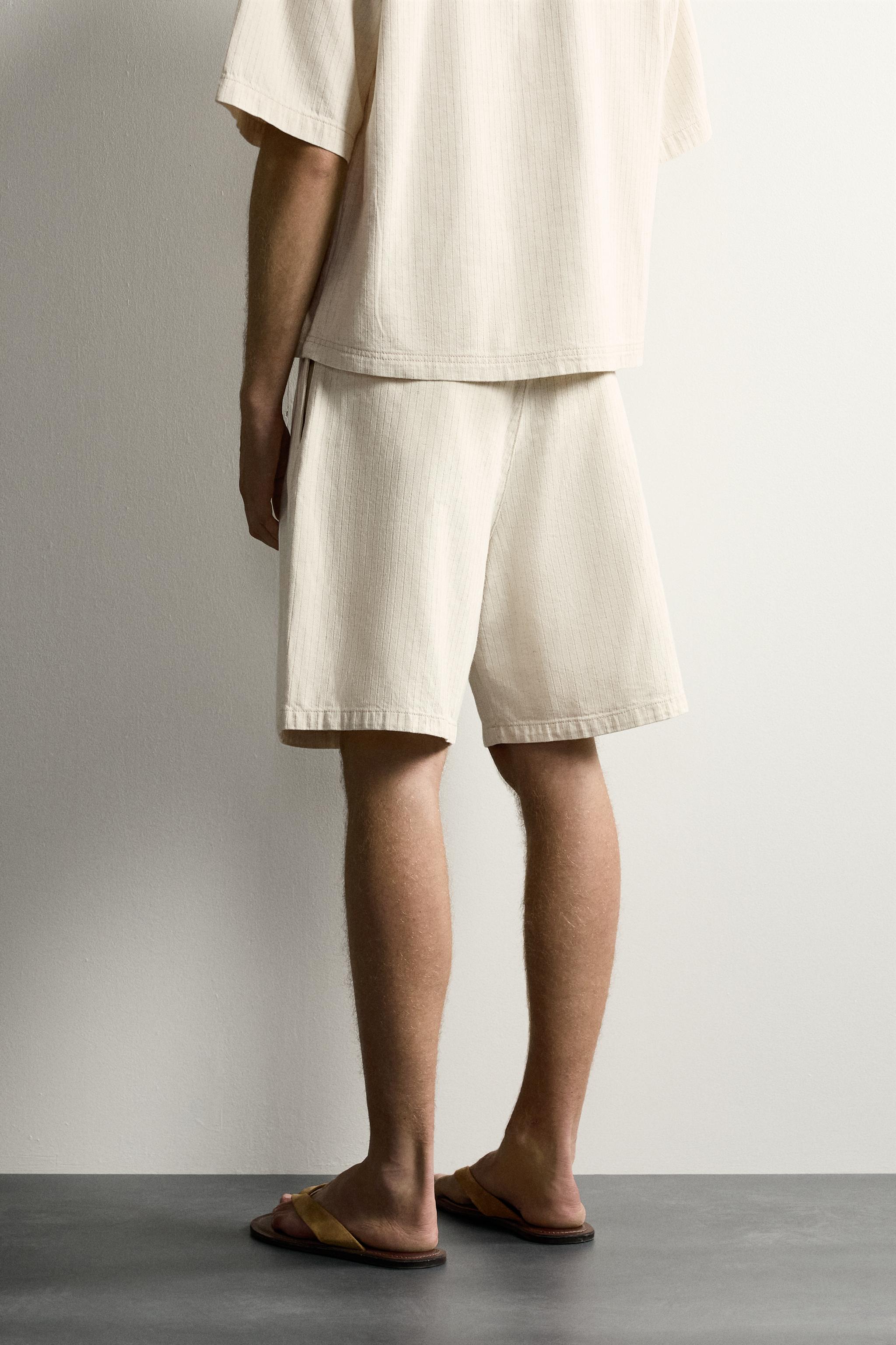 WIDE FIT STRIPED PLEATED SHORTS